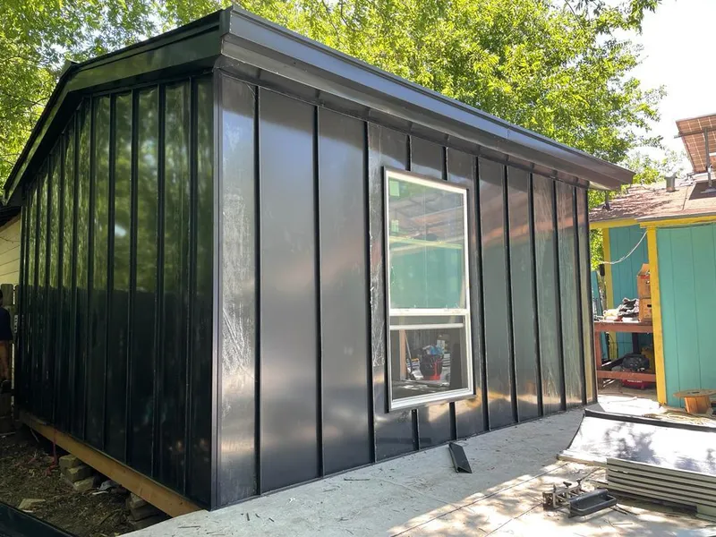 Black standing seam metal wall panels for Roof Inspection in Glen Cove